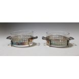 A pair of Viennese Secession style glass dishes in silver plated stands