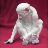 Heubach Gebruder, a porcelain figure of a monkey observing a ladybird, 20cm high