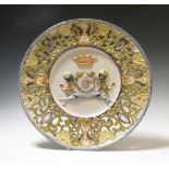A Spanish armorial faience dish bearing the coronet of a marquis in relief, 41cm diameter  Modern