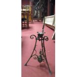 A wrought iron kettle stand, after Christopher Dresser