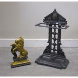 A Victorian style cast iron stick stand and painted lion doorstop