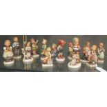 Thirteen Goebel porcelain figures to include March Winds, Goose Girl, Little Goat Herder, Merry