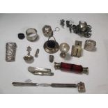 A collection of silver and other items to include a ruby glass double ended scent bottle and a set