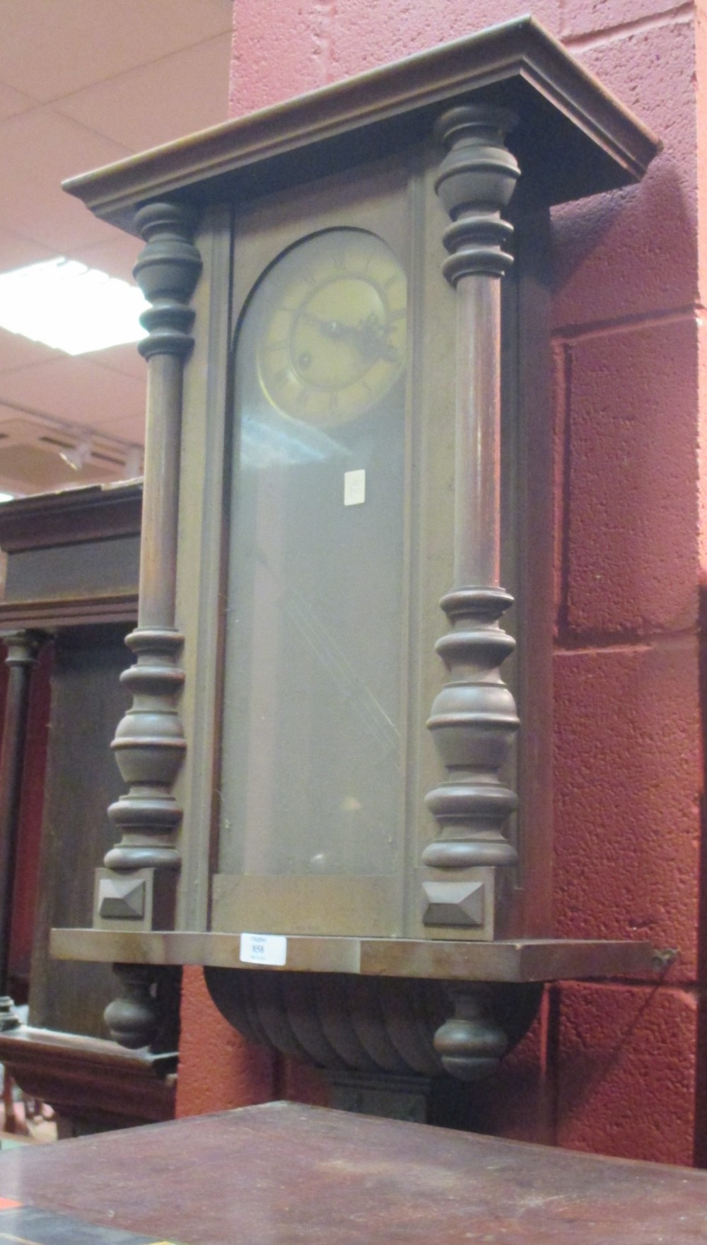 A 19th century Vienna style walnut cased wall clock