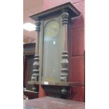 A 19th century Vienna style walnut cased wall clock