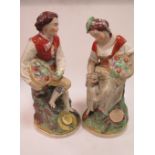 A pair of large 19th century Staffordshire figures, depicting man and wife fruit sellers, seated