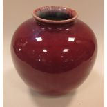 A Chinese red flambe ovoid vase, 22.5cm high