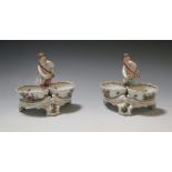 A pair of Berlin figural painted porcelain bonbon dishes, sceptre marks