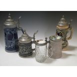 A collection of five various steins