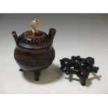 A Chinese bronze censer, a wood stand, the wood cover with Japanese figural finial As you would