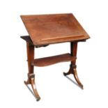 A late George III mahogany architect's table, height adjustable action, the top with hinged slope