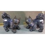 A pair of Chinese stoneware dogs of Fo, 26cm wide