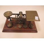 A set of letter scales, together with an inkstand and a brass figure