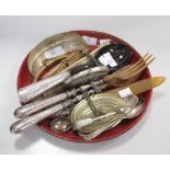 A papier mache tray of salad servers, handbag clasps and other items