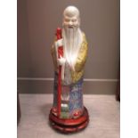 A large Chinese figure of Shoulao with associated hardwood base