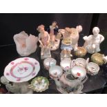 A collection of pottery/porcelain ornaments and figures