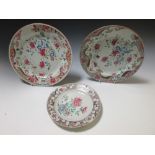 A pair of 19th century Chinese Famille Rose plates and another