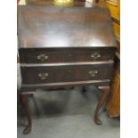 A 1930's mahogany bureau on cabriole legs, 96cm high x 61cm wide