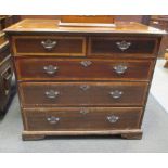 A George III oak chest, containing two short over three long drawers