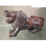 Two carved wood lions, probably Indian, 22cm wide