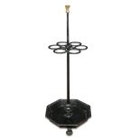 A 19th century cast iron stick stand, with octagonal tray base, on lion paw feet 99cm high x 39cm