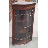 A reproduction mahogany corner cupboard together with another similar