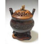 A Chinese bronze censer, wood cover and stand As you would expect. No age.