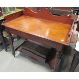 A Victorian mahogany two tier washstand, with gallery back on turned legs, 94cm high x 103cm wide