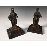 A pair of 19th century bronze figures of Chinese men with moustaches and their hair on a long plait,