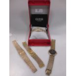 A ladys 9ct Beuche Girod wristwatch, a ladys cased Guess wristwatch, a ladys Citizen wristwatch