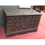 An Arab hardwood chest with brass studded decoration, 58cm high x 93cm wide