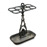 A 19th century cast iron stick stand, with leaf cast column, tray base and lapit moulded border,