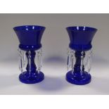 A pair of blue glass lustres