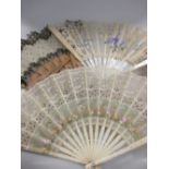 A painted lace fan and two others boxed