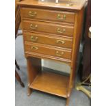 An Edwardian mahogany music cabinet