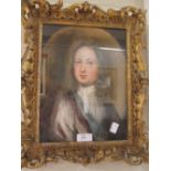 Portrait of a gentleman in a gilt frame, pastel, together with two framed watercolours of crests (3)