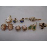 A 9ct garnet ring, an Edwardian zircon and diamond bar brooch, two pairs of cameo earrings and a