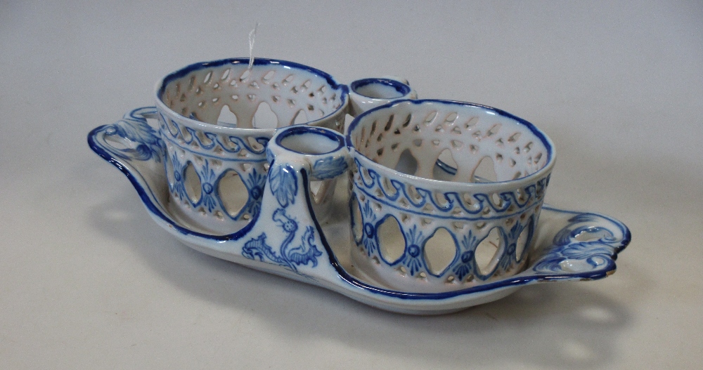 A Galle faience blue and white bottle cradle