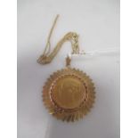 An 1875 sovereign necklace, in a precious yellow mount stamped 18 to bale and on a chain stamped 585