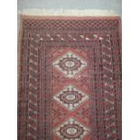 An Indian Tekke style runner, 320 x 96cm