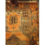 An orange ground rug, 257 x 130cm