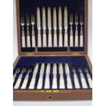 A late Victorian set of Twelve pairs of electroplated dessert knives and forks each with mother of
