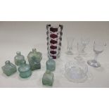 Seven glass inkwells, a vase and three wine glasses