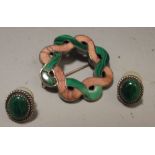 A pair of malachite cabouchon earrings and a malachite and pink hardstone white metal backed knot