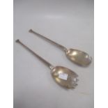 A pair of silver salad servers of Art Deco shape, together with a quantity of silver plated flatware