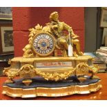 A 19th century gilt metal and porcelain mounted figural timepiece