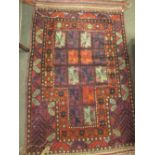 A purple ground rug with geometric design, 135 x 85cm