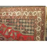 A Caucasian wool rug, 212 x 136cm