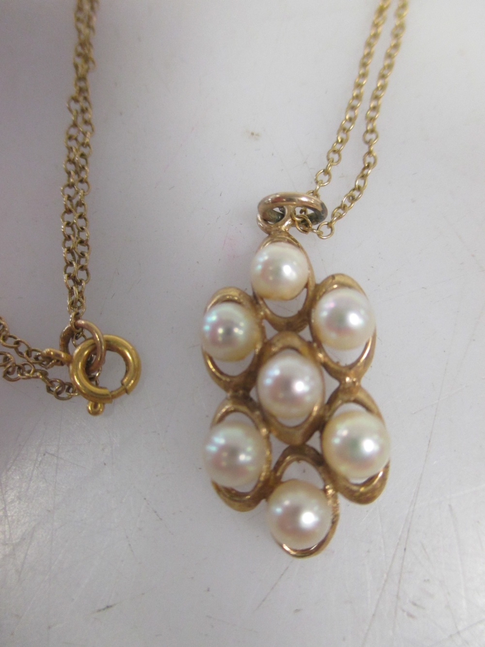 A pearl necklace stamped 750 to clasp (2g), a 9ct pearl pendant and unmarked chain, a 9ct locket and - Image 2 of 3