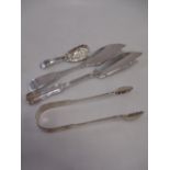 Two silver butter knives, a caddy spoon and a pair of sugar tongs